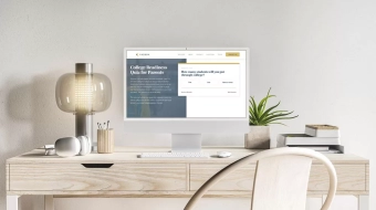 Desktop with a mac displaying a full screen view of the Carson Wealth College Planning Calculator