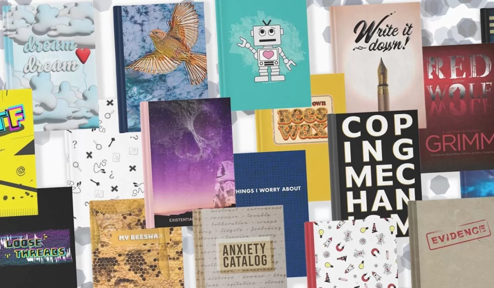 Collection of journal cover designs arranged in a haphazard overlapping way with confetti in the background